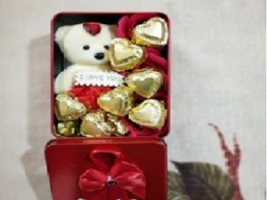 Red decorative box with teddy and chocolates